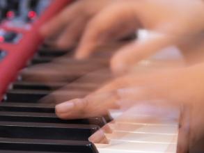hands playing a keyboard